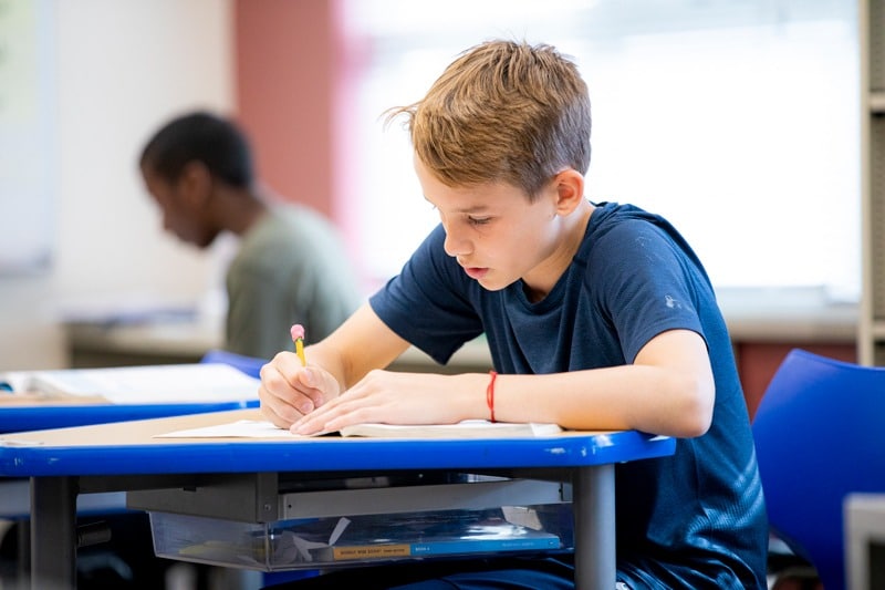 boy student working at desk