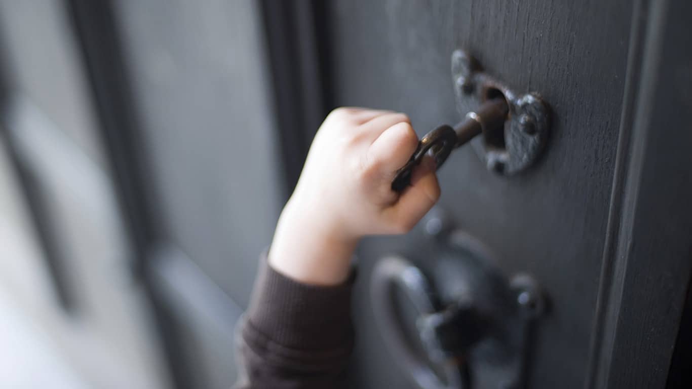 photo child hand unlocks door
