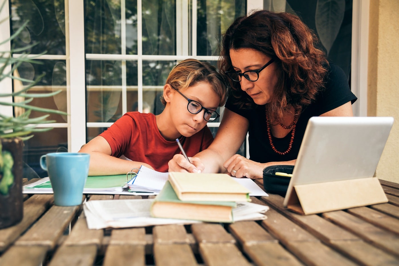 a parent and child doing homework together