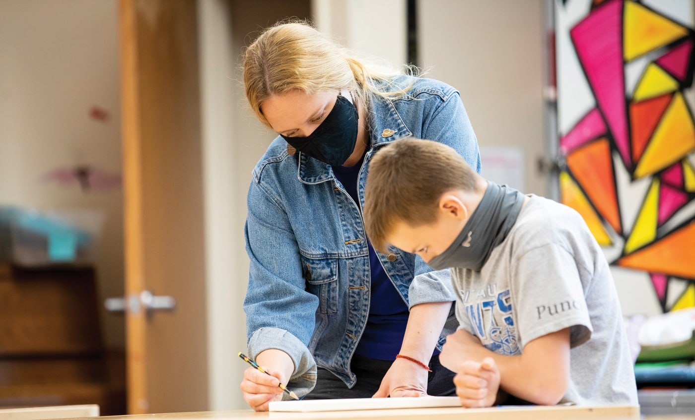 a Groves teacher works with a student during the 2020-2021 school year