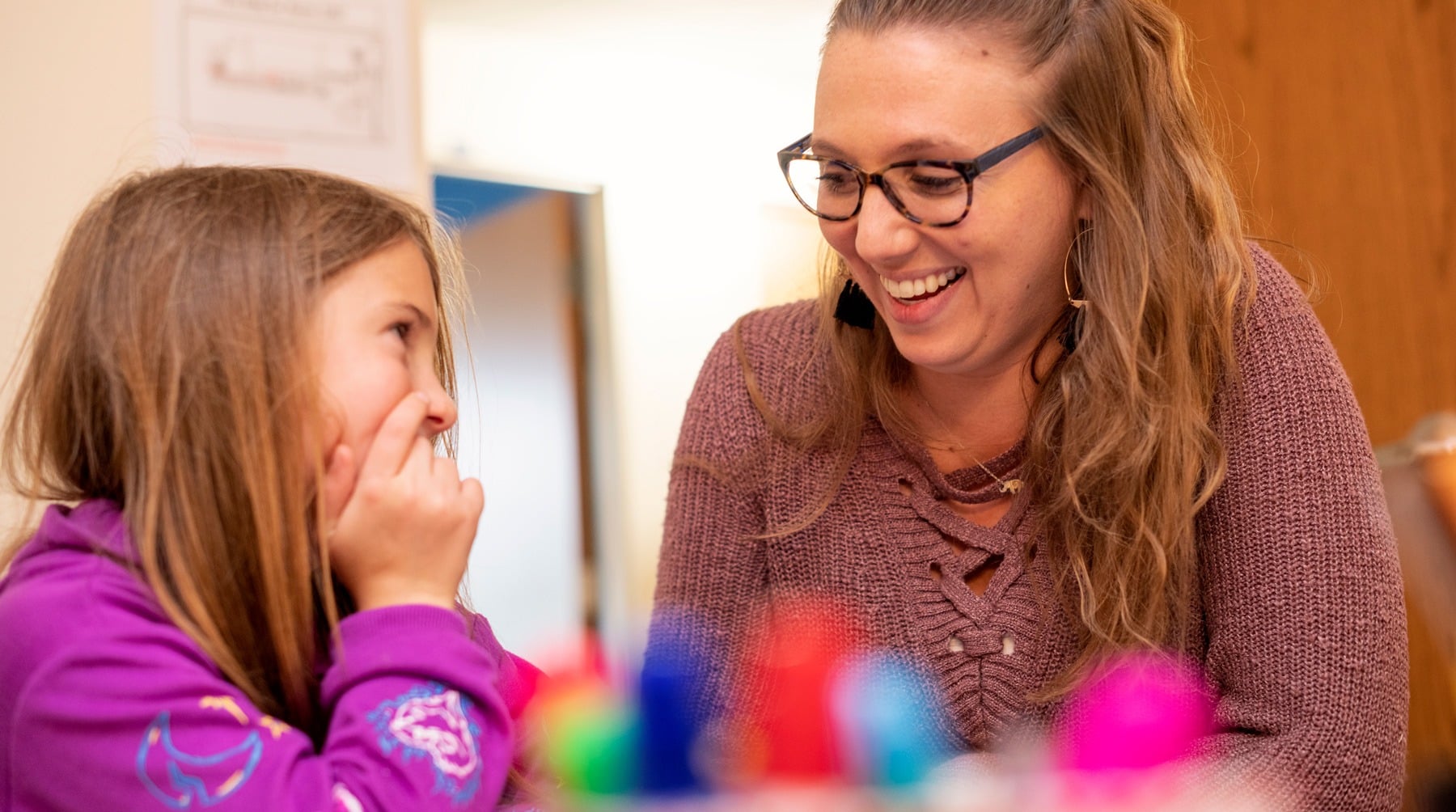 speech-language therapist talking to a student