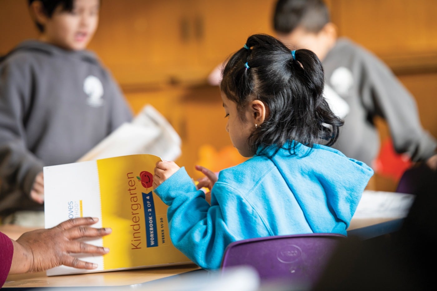 kindergartner with workbook