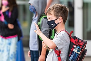 boy wearing mask